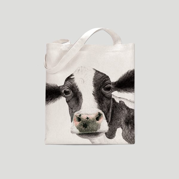 A black and white cow on a tote bag  - by Charlotte Nicolin